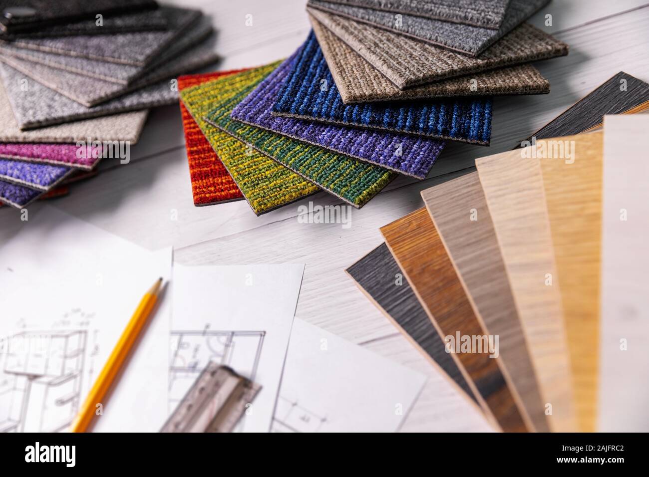 flooring and furniture materials - floor carpet and wooden laminate samples for interior design project Stock Photo