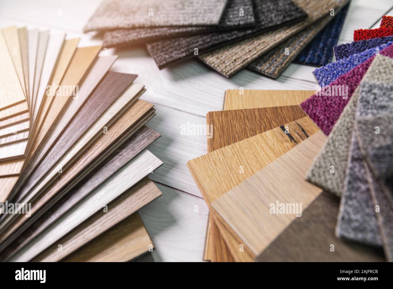 flooring and furniture materials - floor carpet and wooden laminate samples Stock Photo