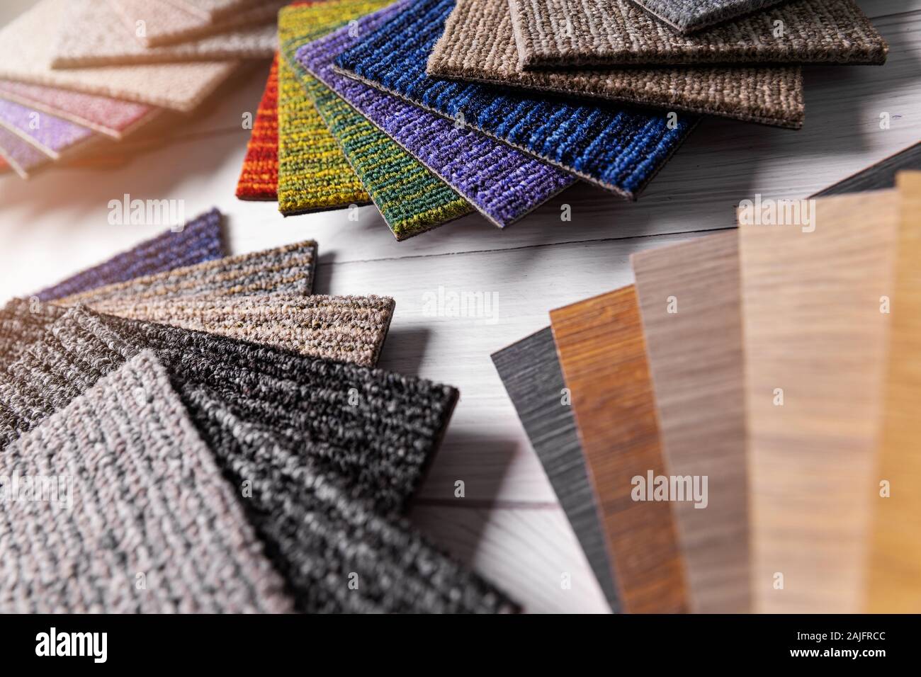 flooring and furniture materials - floor carpet and wooden laminate samples Stock Photo
