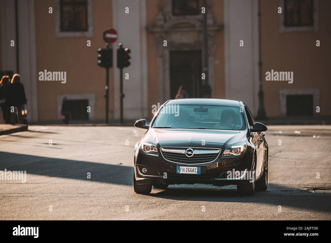 Rome, Italy - October 19, 2018: Black Color Opel Insignia With Face-lift In First Generation Moving At Street. Insignia is a family car engineered and Stock Photo