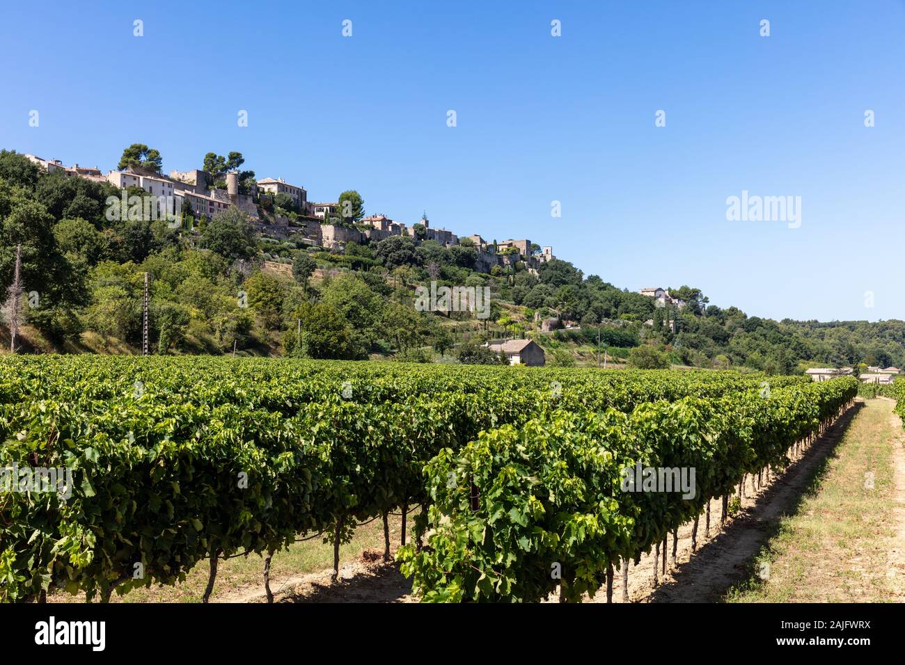 View of a typical French village and vinyard in the Luberon, Provence, Southern France Stock Photo