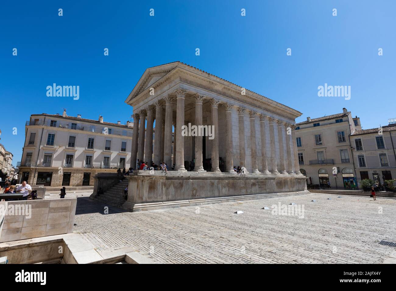 Ancient Roman construction, Maison Carree in the city centre of Nimes, Provence, Southern France Stock Photo
