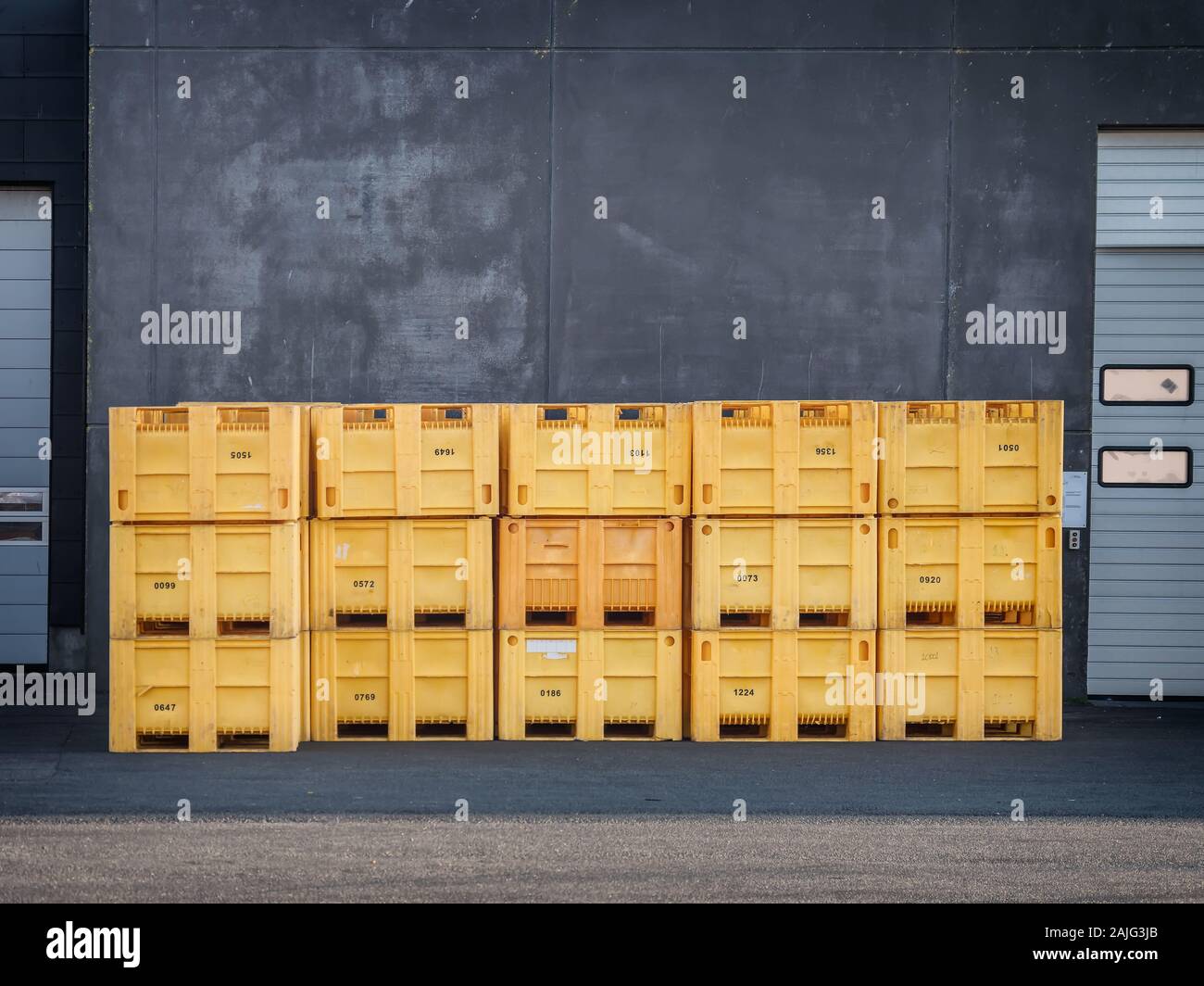 Industrial fish containers in Thyboroen harbor, Denmark Stock Photo