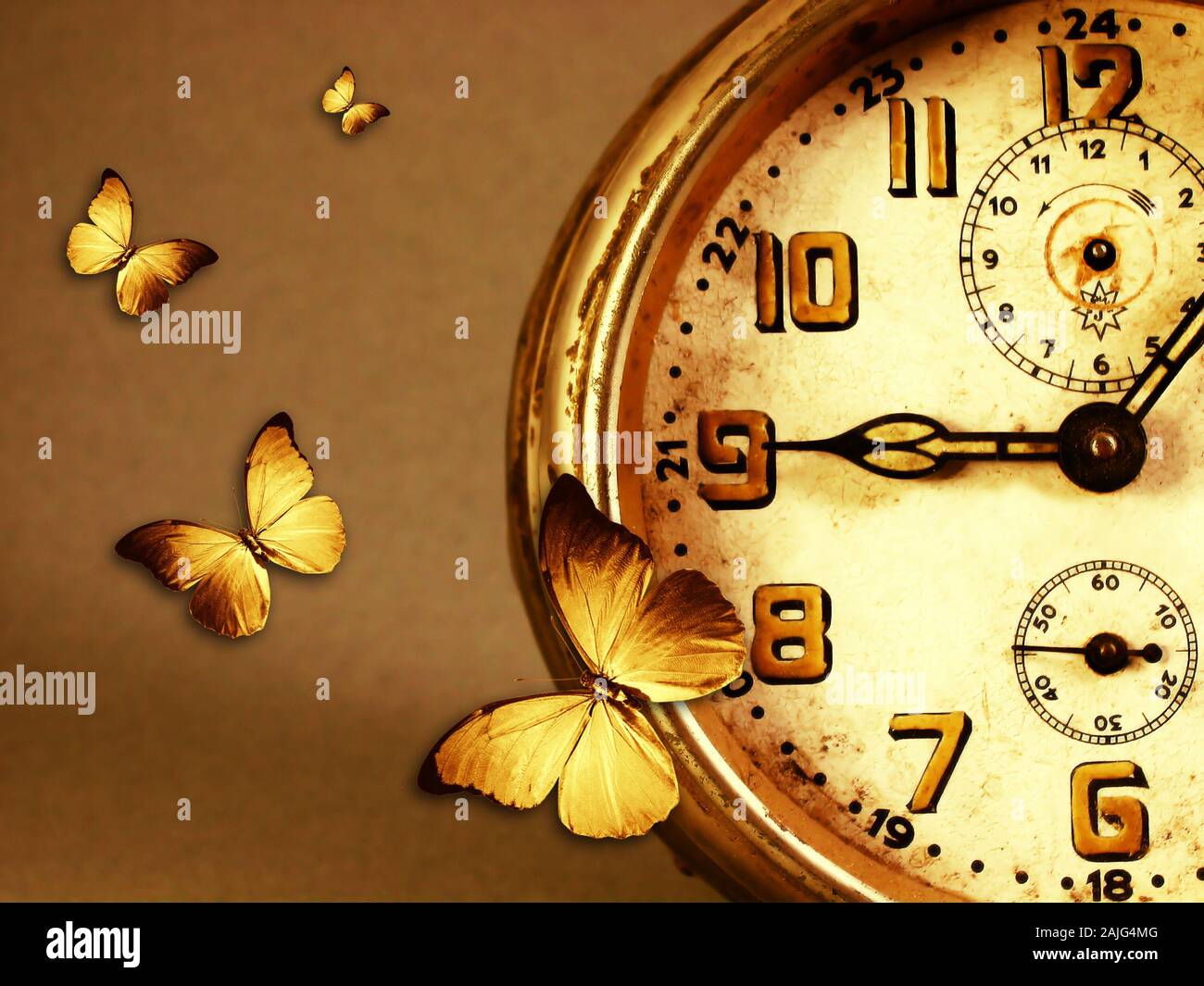 butterflies flying around an old vintage clock Stock Photo Alamy