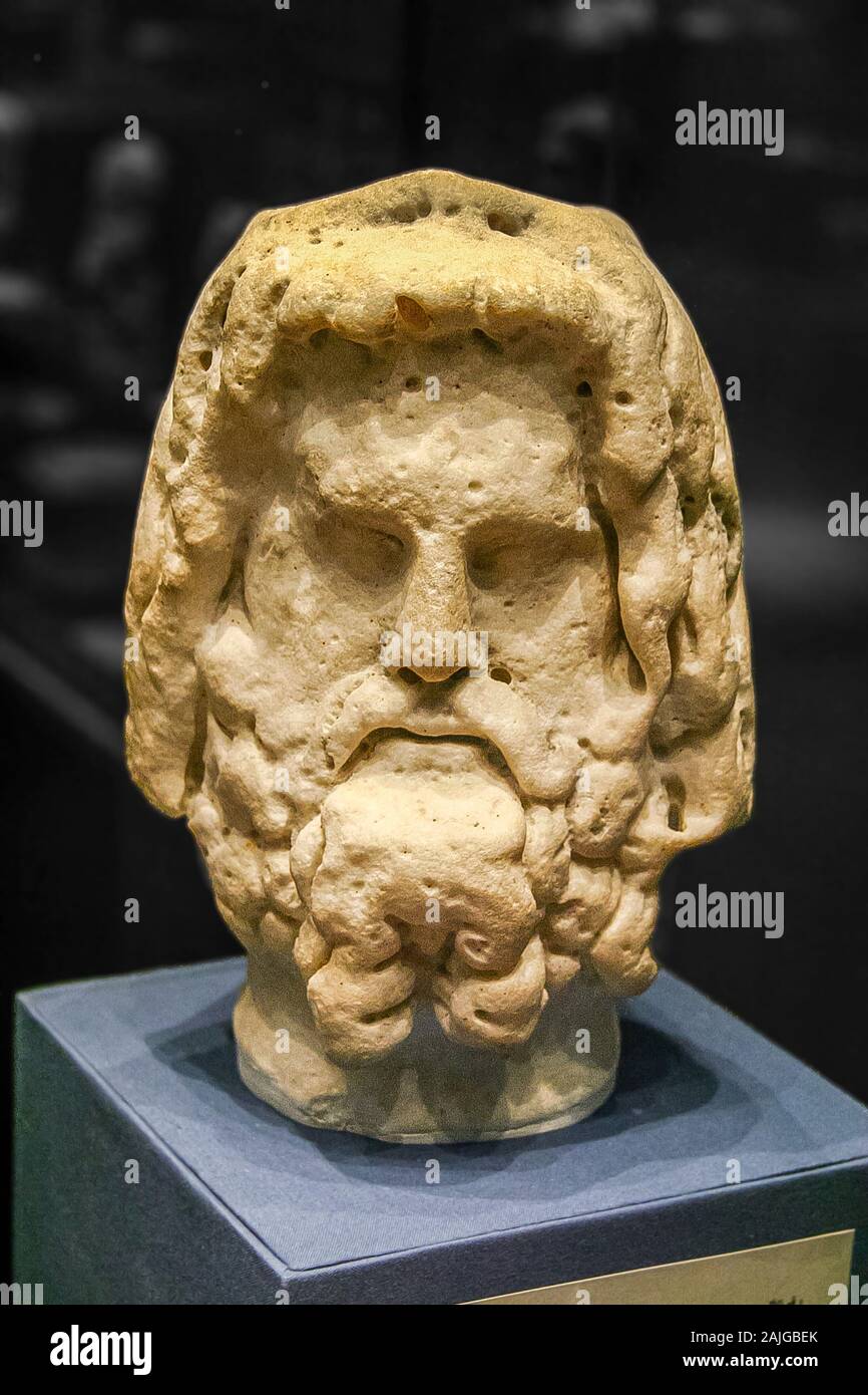 Egypt, Alexandria, Archeological museum of the Bibliotheca Alexandrina, head of the god Serapis, with his typical curly hair and beard. Marble. Stock Photo