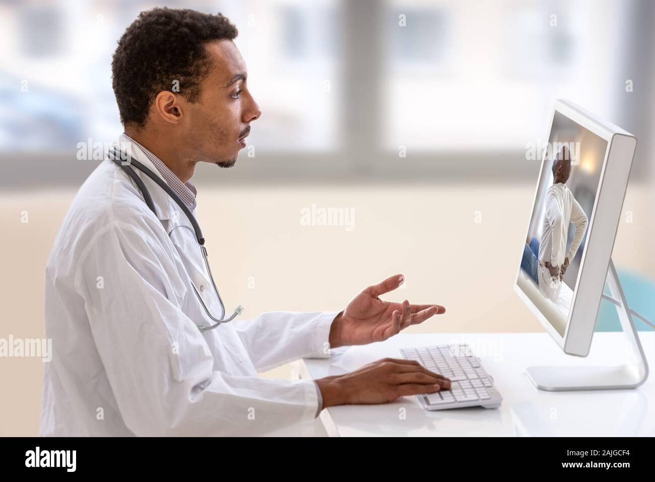 Telemedicine or telehealth concept, doctor with a stethoscope on the computer laptop screen. Stock Photo