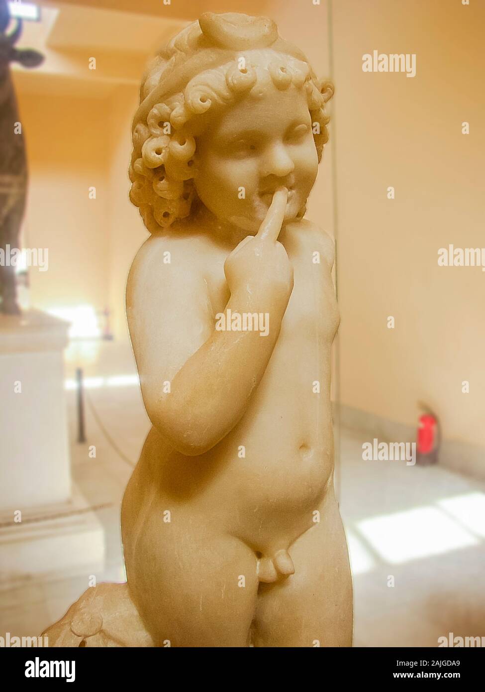 Egypt, Alexandria, Graeco-Roman Museum, statue of Harpocrates. The style is Greek, but the finger in the mouth is Egyptian and is a mark of childhood. Stock Photo