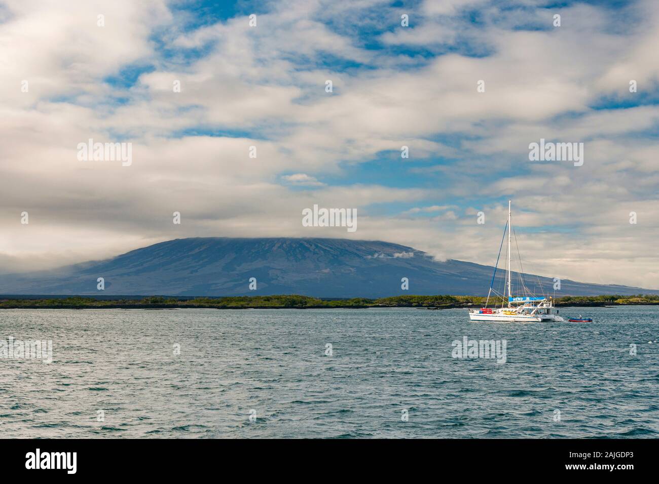 Catamaran anchored off Punta Moreno on Isabela island, Galapagos, Ecuador. Stock Photo