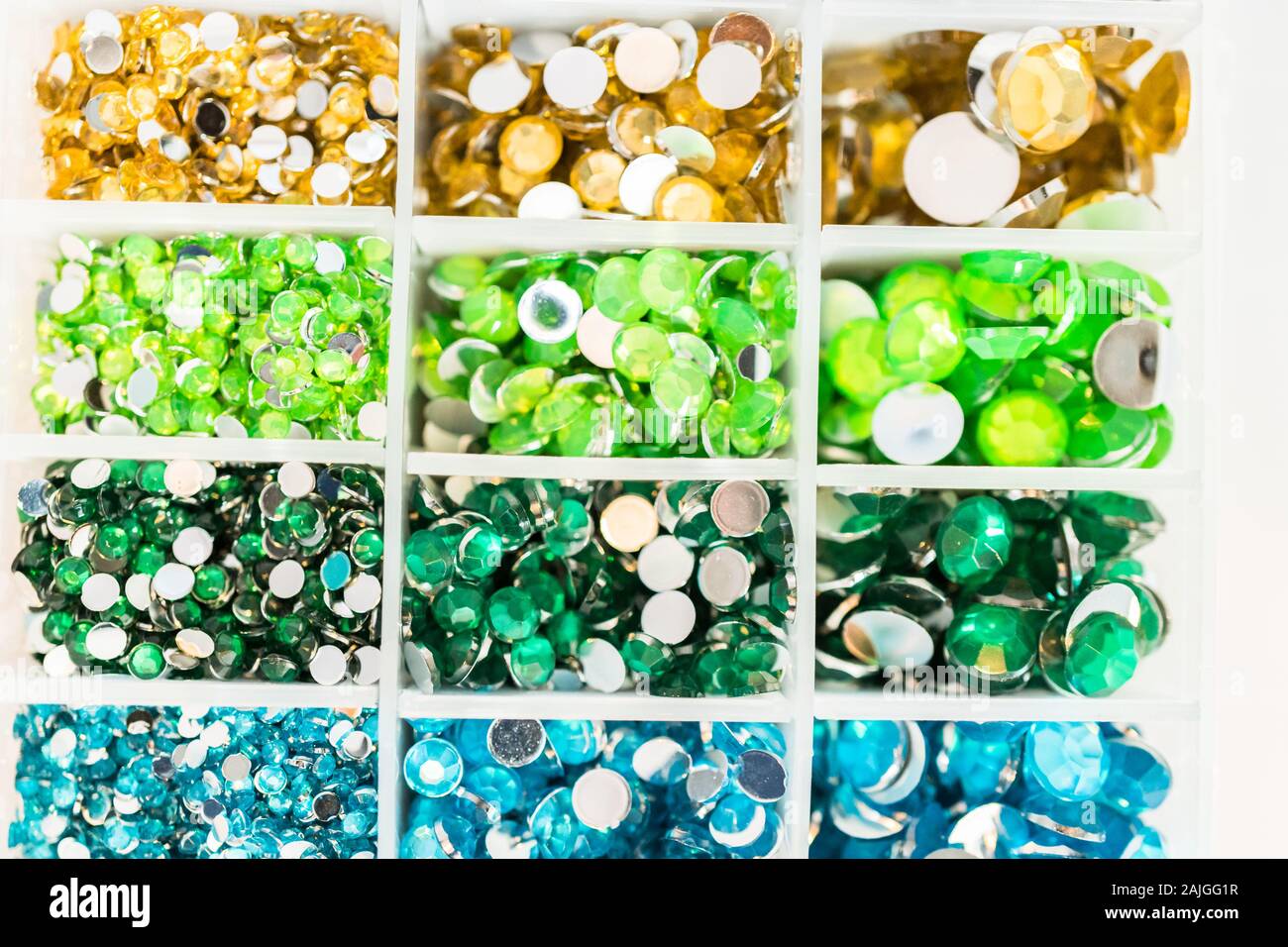 Comparing Craft Rhinestones Color and size variety of rhinestones in the craft box Stock Photo - Alamy