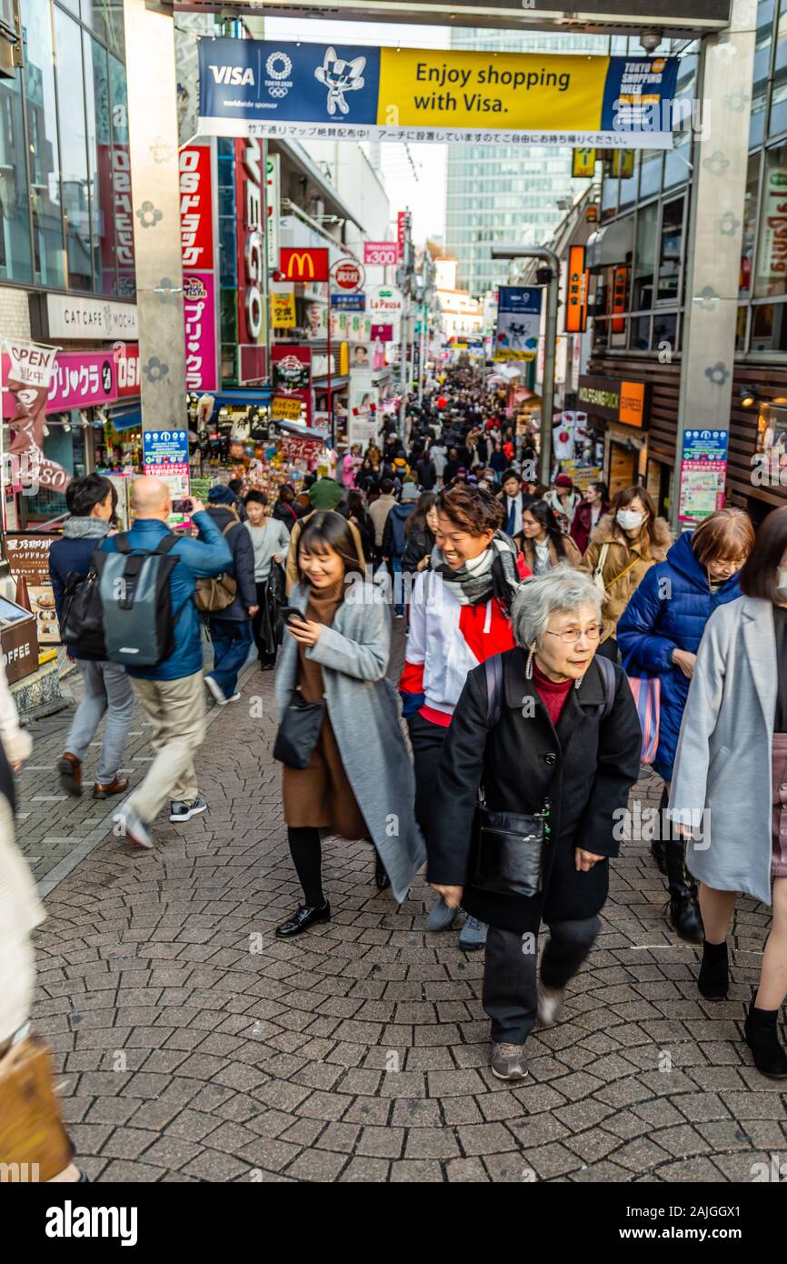 TOKYO, JAPAN - FEBRUARY 7, 2019:  Unidentified people walk along Takeshita street in Harajuku, a famous Japanese cosplay fashion street. Stock Photo
