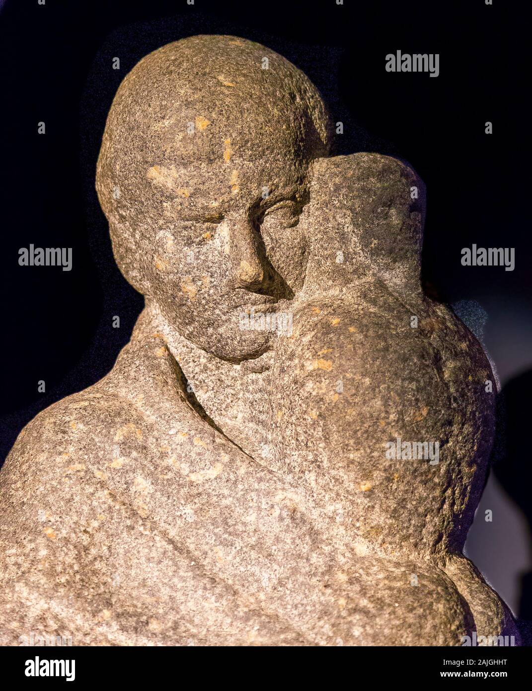 Opening visit of the exhibition “Osiris, Egypt's Sunken Mysteries”. Detail of a statue of a man, probably an Osiris priest, carrying a canopic jar. Stock Photo