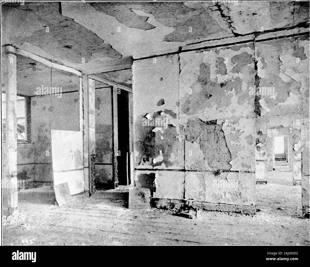 The San Francisco earthquake and fire; a brief history of the disaster; a presentation of facts and resulting phenomena, with special reference to the efficiency of building materials, lessons of the disaster . MERCHANTS EXCHAN(;E l$UILI)IN(i. First Story. Showing condition of Itoehling fire-proof floors, partitions,column covering and ornamental lath and ))laster ceiling in the l)anking room of the American National Bank. Everythingcombustible in this room was consumed, the vaults remaining in good condition. A temporary wood floor was being laidat the time that the photograph was taken. 161. Stock Photo