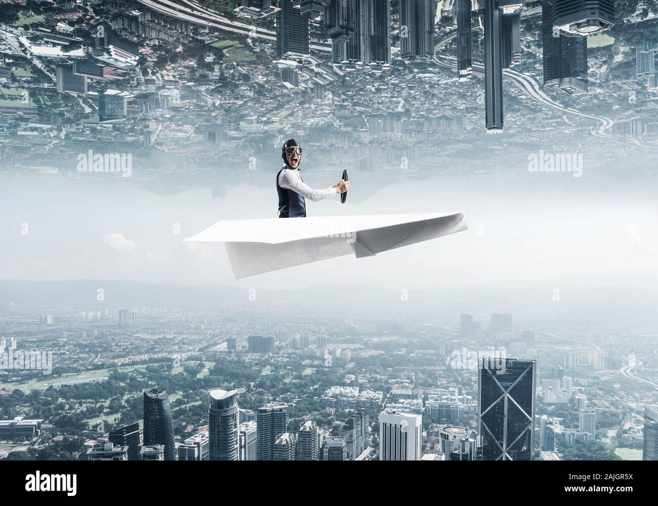 Happy aviator driving paper plane. Two modern urban worlds located ...