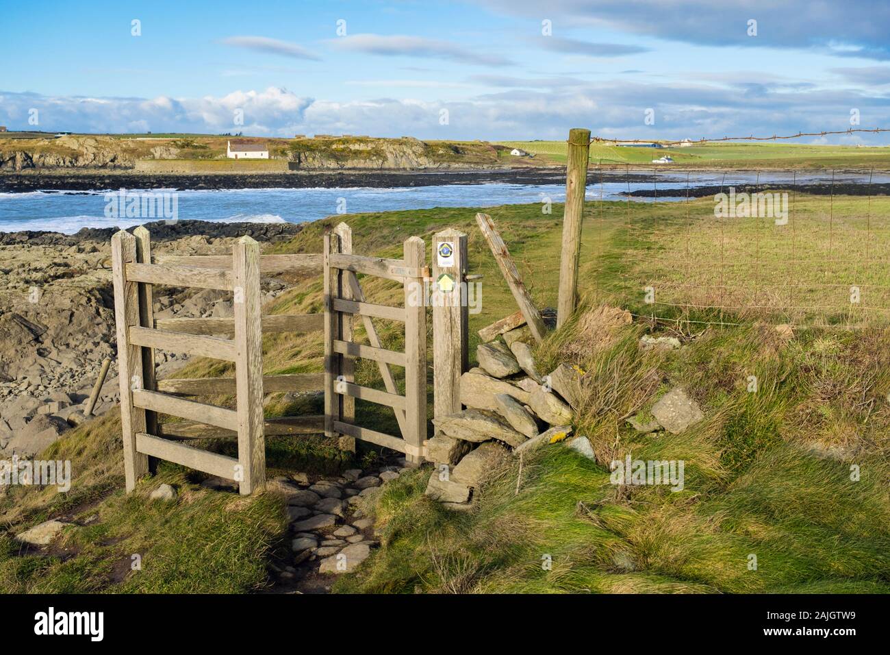 Kissing gate on Welsh coastal footpath at Porth Cwyfan, Aberffraw, Isle of Anglesey, north Wales, UK, Britain Stock Photo