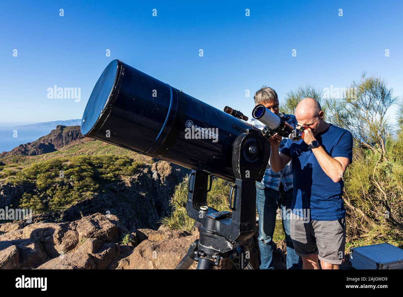 Observing the sun through a sol searcher solar telescope alongside a twelve  inch Meade LX200R, in Masca, Tenerife, Canary Islands, Spain Stock Photo -  Alamy