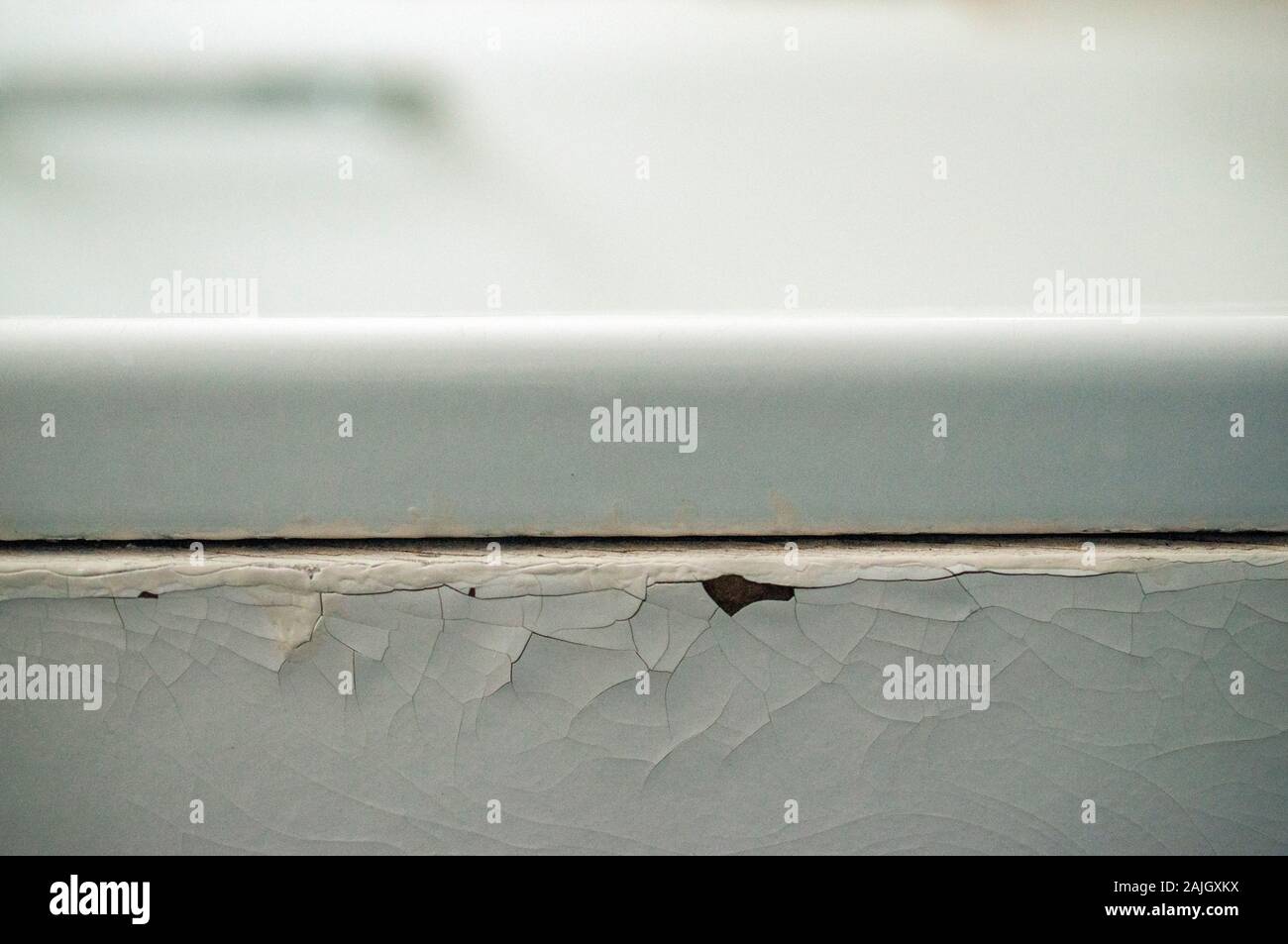 Old bathtub with peeling white paint Stock Photo Alamy