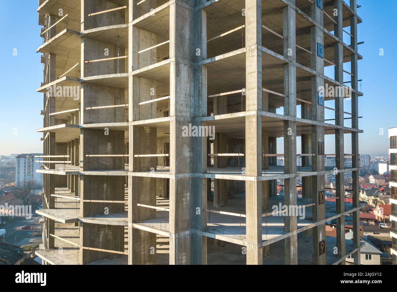 Aerial view of concrete frame of tall apartment building under ...