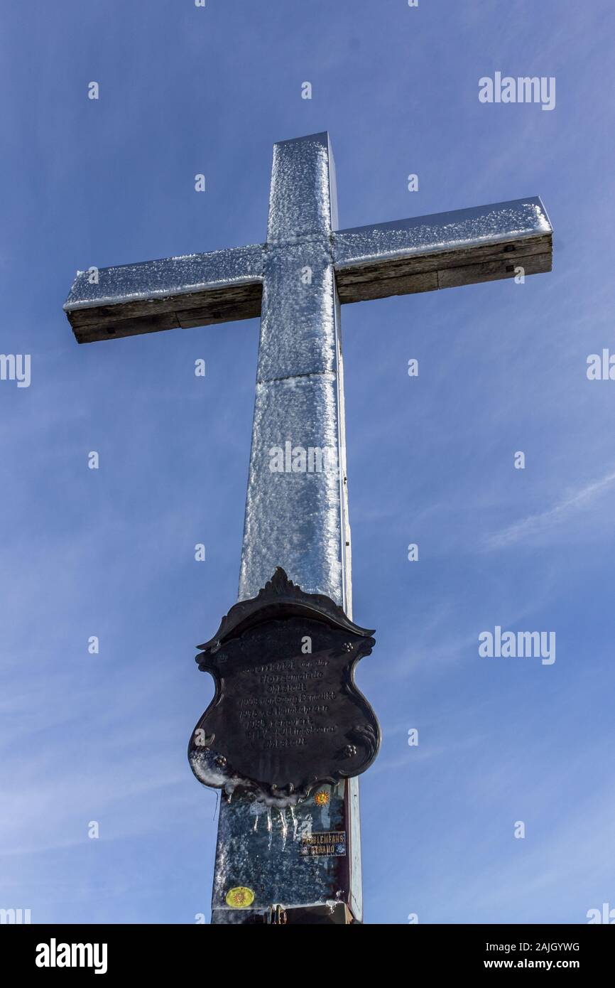 Details of frozen Summit Cross of Mount Heimgarten, 1791 m in Bavarian Prealps, located in Ohlstadt, Upper Bavaria, Germany Stock Photo