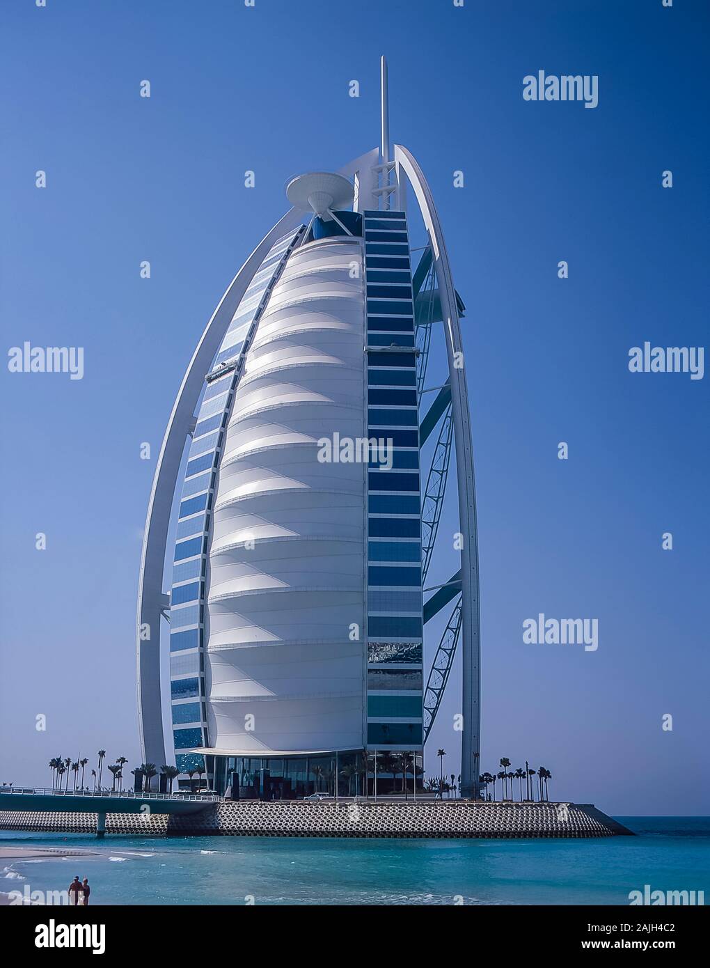 The world famous Burj al Arab Tower hotel at Jumeirah in the Emirate of Dubai. The themed architecture is to resemble a billowing sail from an Arabian Dhow reflecting Dubai's seafaring heritage with the sea and pearling industry Stock Photo