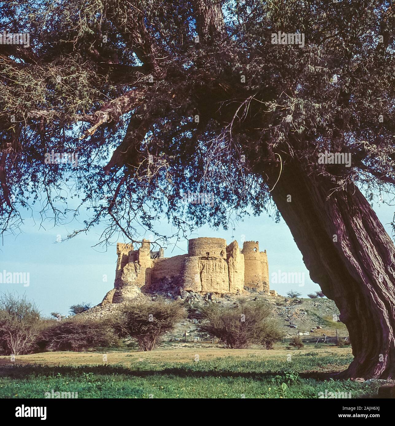 The abandoned ruins of Fujairah Fortress in the Emirate of Fujairah in the UAE located overlooking the Arabian Sea and Indian Ocean. The fort has since been renovated as a tourist attraction. Stock Photo