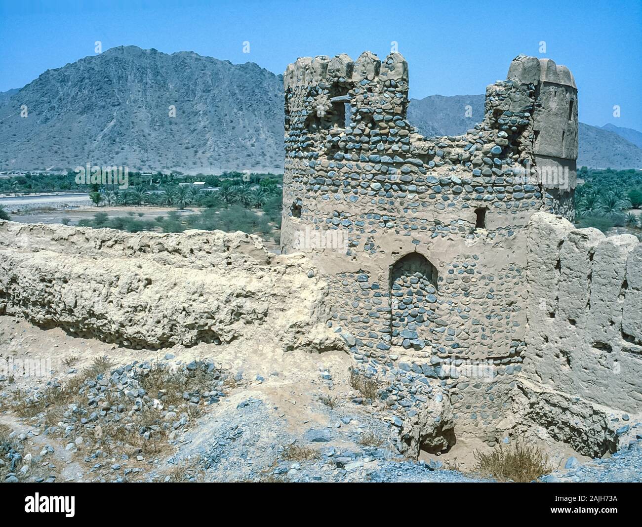 The abandoned ruins of Fujairah Fortress in the Emirate of Fujairah in the UAE located overlooking the Arabian Sea and Indian Ocean. The fort has since been renovated as a tourist attraction. Stock Photo