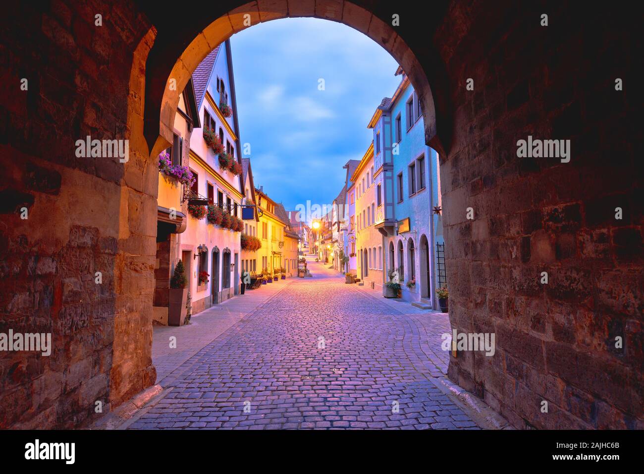 Cobbled street of historic town of Rothenburg ob der Tauber dawn view, Romantic road of Bavaria region of Germany Stock Photo