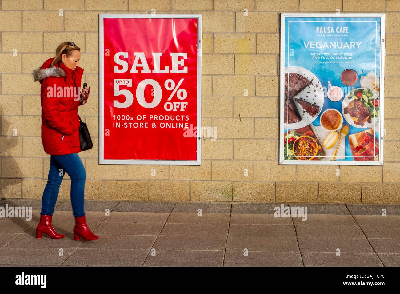 Vegetarianism, vegan, vegetarian, veganism, vegans diet foods; Seafront Retail Park in Southport, UK. January sales under way as shoppers search for bargains. Vegan poster advertises Vegan meals in the Dunelm Pausa cafe. Stock Photo
