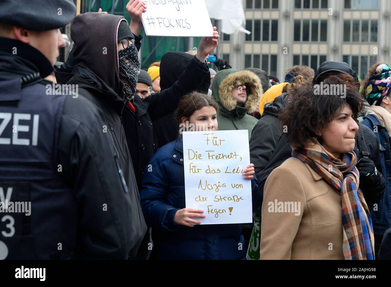 Cologne, Germany. 04th Jan, 2020. Demonstrators from 'Cologne against the Right' protest against a rally of the party 'Alternative for Germany' (AfD) against broadcasting fees and the WDR. The trigger for the AfD rally was the satirical 'Umweltsau' video, which was broadcast on WDR at Christmas and led to a shitstorm in the social media and subsequently to death threats against WDR employees. Credit: Roberto Pfeil/dpa/Alamy Live News Stock Photo