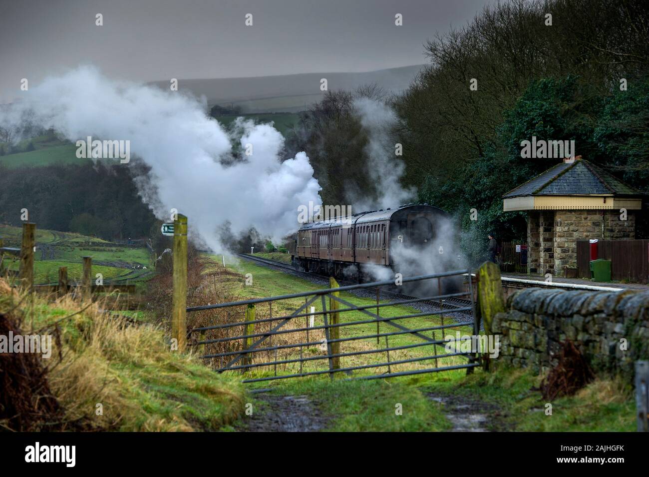 East Lancashire Railway, Rossendale, Lancashire, 4th January 2020. Passengers enjoy a run on the last weekend of the Christmas holidays through the mist and drizzle along the volunteer run heritage railway. Credit: Paul Heyes/ Alamy Live News Stock Photo