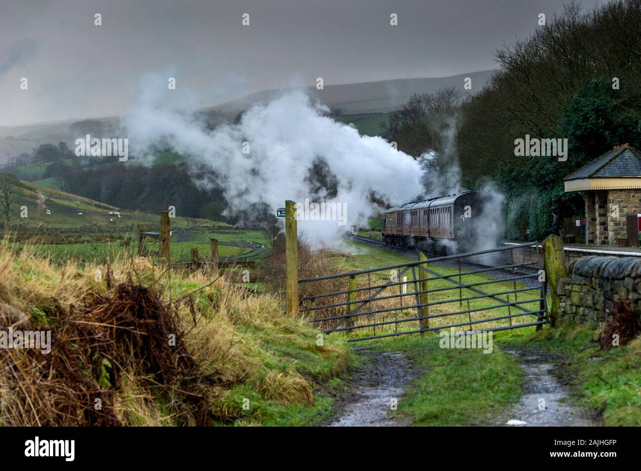 East Lancashire Railway, Rossendale, Lancashire, 4th January 2020. Passengers enjoy a run on the last weekend of the Christmas holidays through the mist and drizzle along the volunteer run heritage railway. Credit: Paul Heyes/ Alamy Live News Stock Photo
