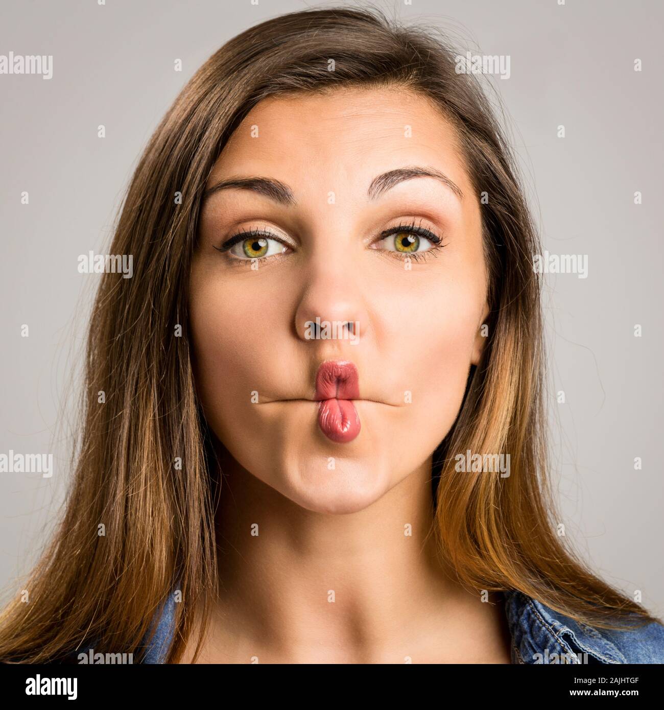 Portrait of a beautiful woman making a pout expression Stock Photo - Alamy