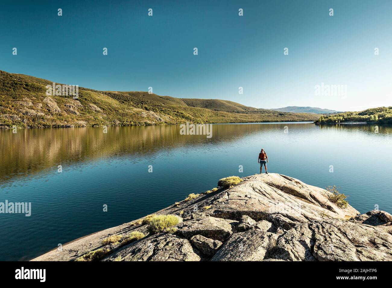 Rear view of a man near a beautiful lake Stock Photo
