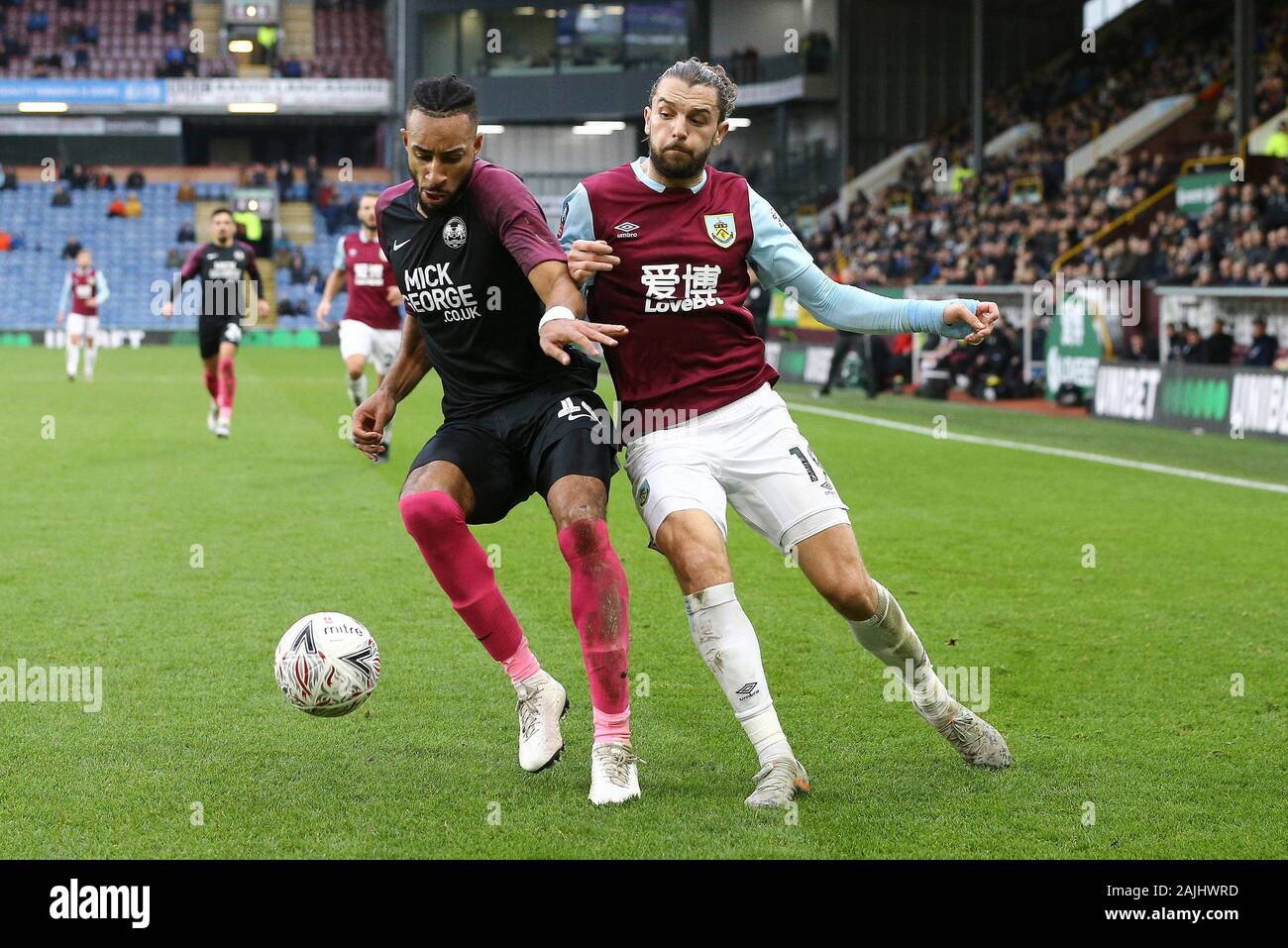Burnley, UK. 04th Jan, 2020. Rhys Bennett of Peterborough United (l) and Jay Rodriguez of Burnley battle for the ball. The Emirates FA cup, 3rd round match, Burnley v Peterborough Utd at Turf Moor in Burnley, Lancashire on Saturday 4th January 2020. this image may only be used for Editorial purposes. Editorial use only, license required for commercial use. No use in betting, games or a single club/league/player publications. pic by Chris Stading/Andrew Orchard sports photography/Alamy Live news Credit: Andrew Orchard sports photography/Alamy Live News Stock Photo
