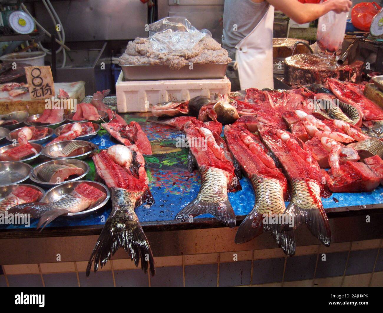 Grass or Amur carp (Ctenopharyngodon idella) for sale in a chinese market  (Canton) Stock Photo