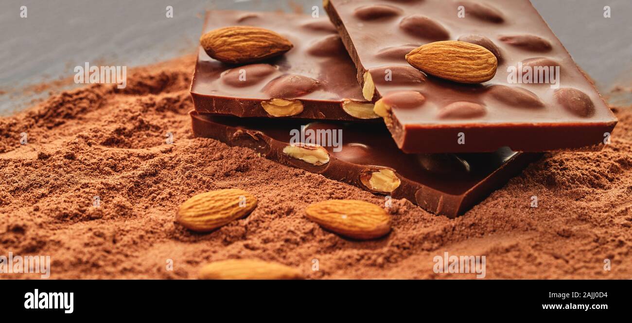 chocolate bar on a background of cocoa powder Stock Photo - Alamy