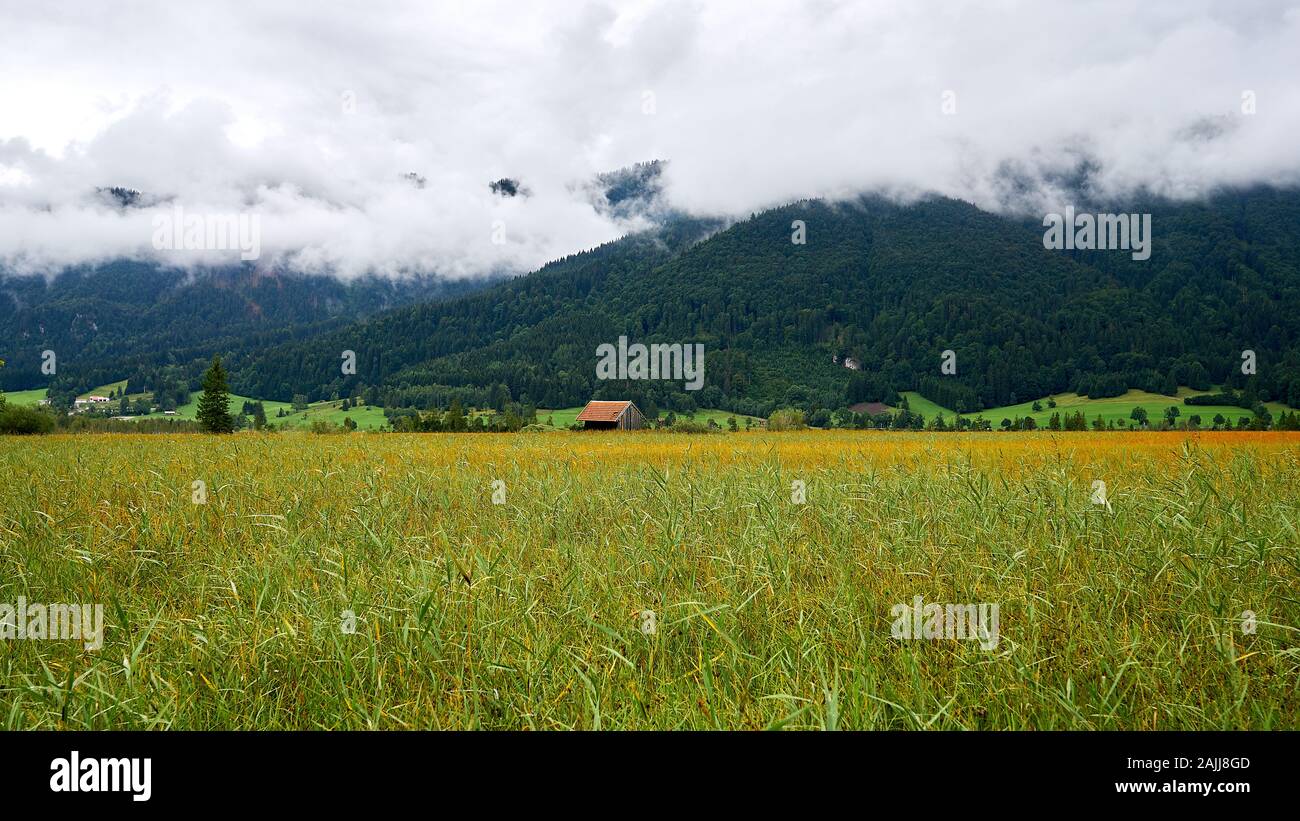 Landscape of cloud shrouded mountain foothills in Southern Bavarian ...