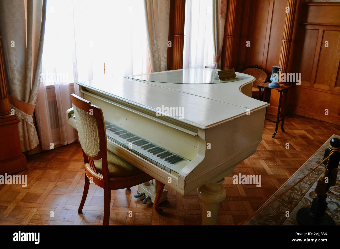 Crimea, Livadia - May 14.2012: Interior living room (boudoir) with a white grand piano Empress Alexandra Feodorovna, wife of Russian Emperor Alexander Stock Photo