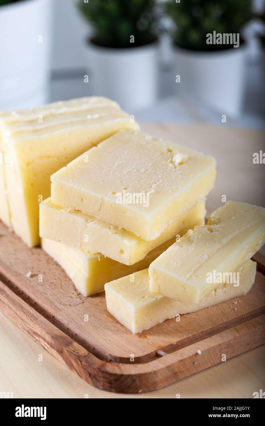 Sliced Tulum Cheese (Turkish: tulum peyniri). Stock Photo