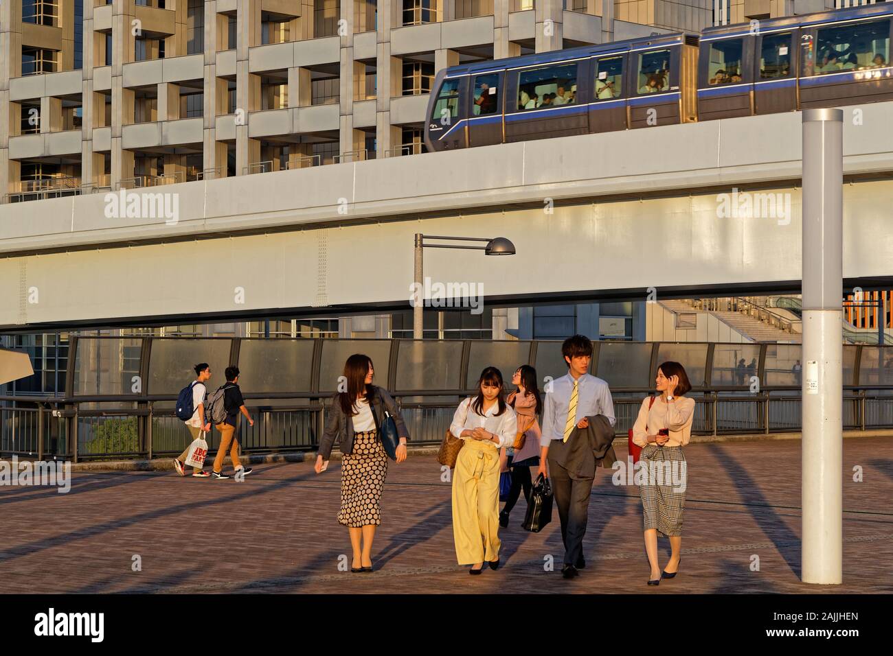 TOKYO, JAPAN, May 17, 2019 : Young japanese people walk under the train in Odaiba Stock Photo