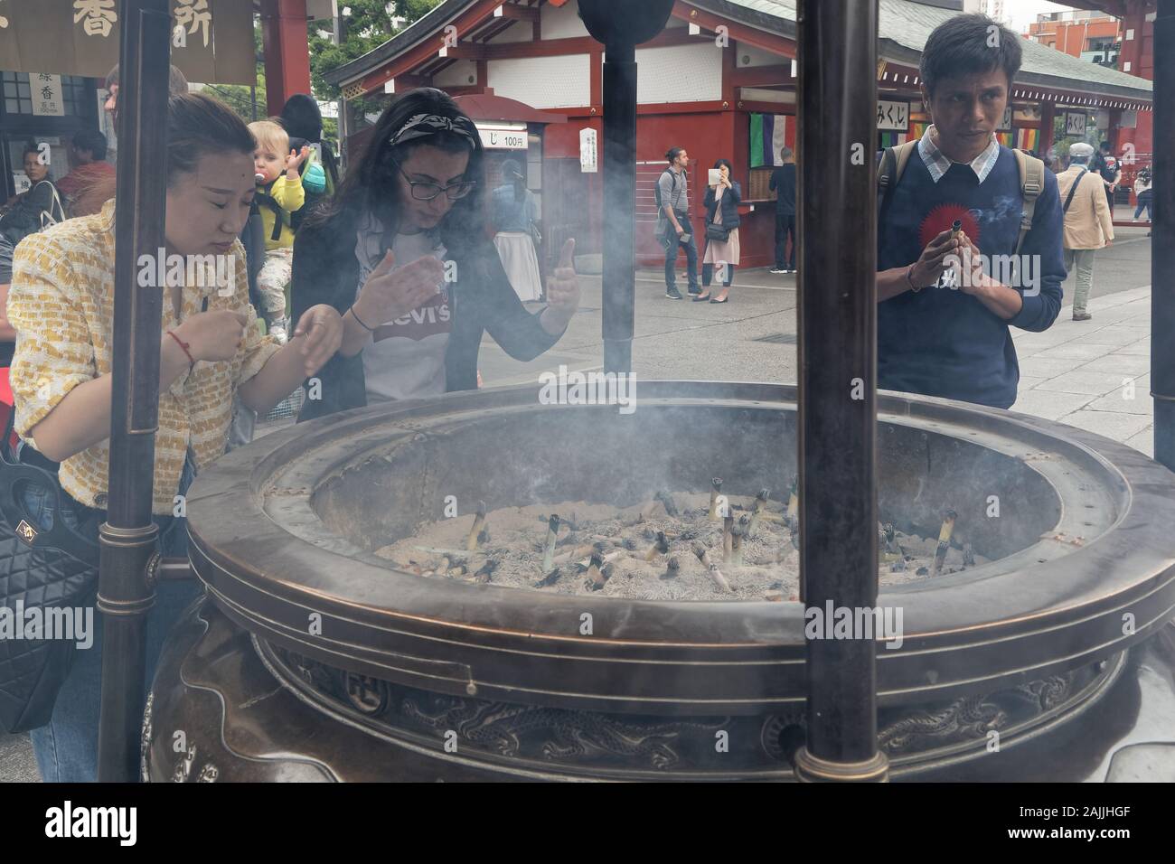 TOKYO, JAPAN, May 9, 2019 : Senso-Ji temple, Asakusa district. Many Japanese people envelop themsleves in incense smoke and performed traditional ablu Stock Photo