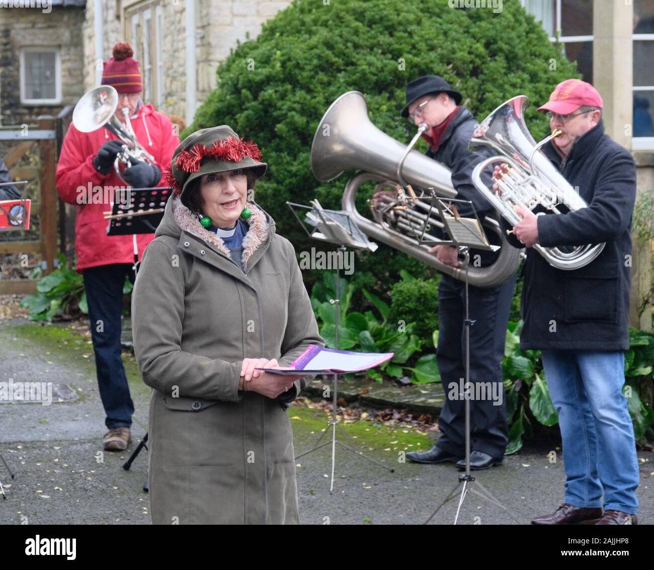 Carols Led by the Vicar. Boxing Day Traditions in Marshfirld Village wiltshire UK Stock Photo