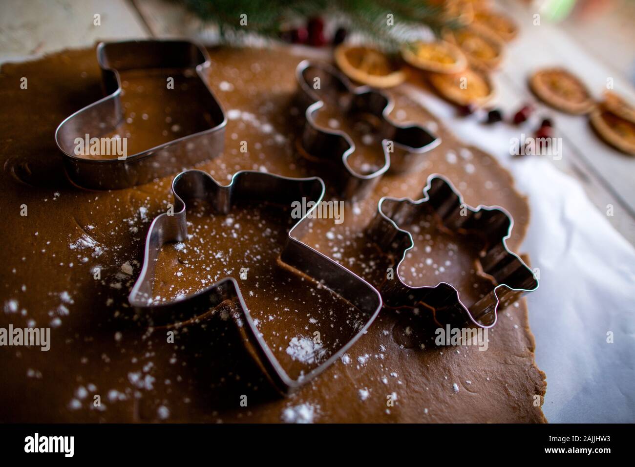 Close up side angle shot of holiday angel cookie cutter on dough Stock Photo