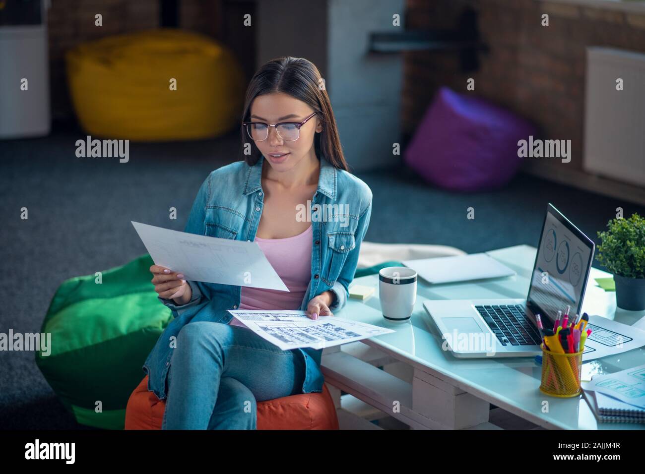 Nice young woman being engaged in work Stock Photo