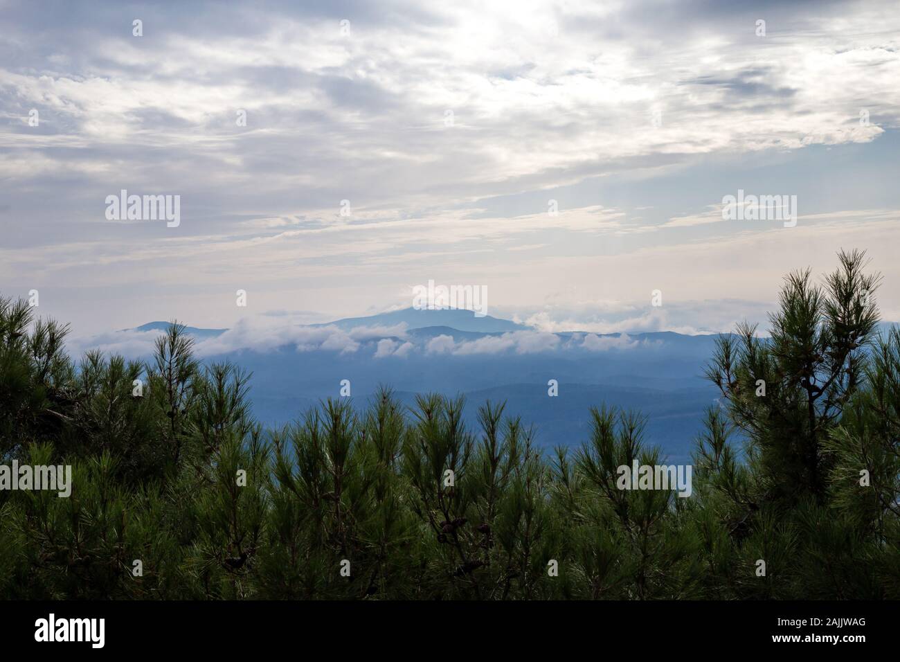 Green mountain covered by cloudy sky. Fethiye, Mugla, Turkey. Stock Photo