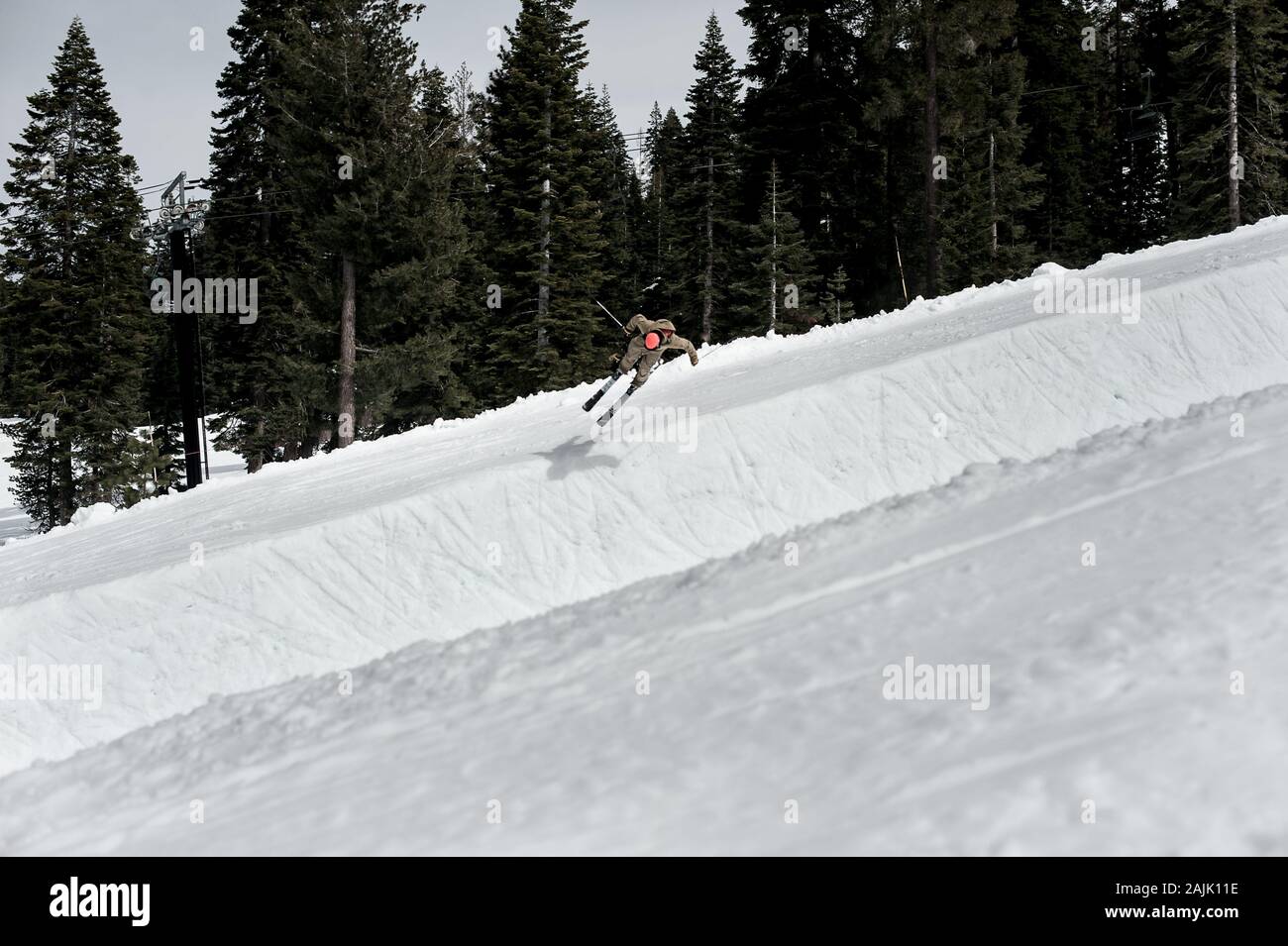 skier jumping into half pipe in lake tahoe, ca Stock Photo