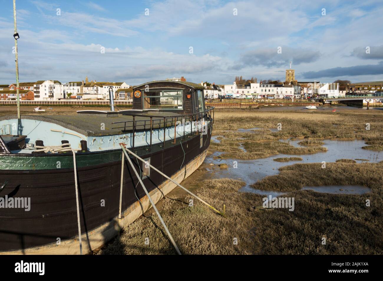 Houseboat moored on mudflats of the River Adur, Shoreham-by-Sea; West Sussex; England, United Kingdom, Europe Stock Photo