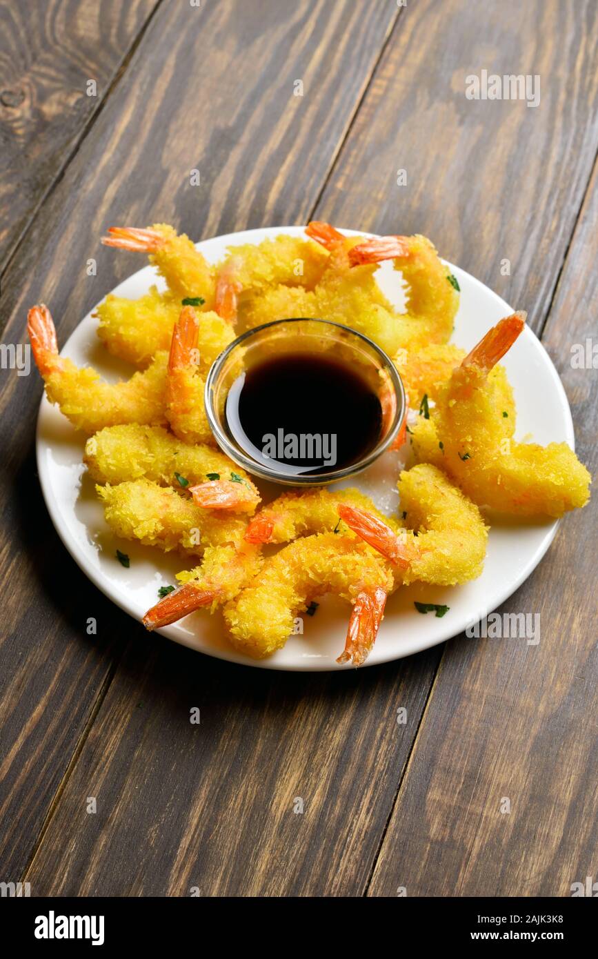 Deep fried breaded shrimp with sauce on wooden table Stock Photo Alamy