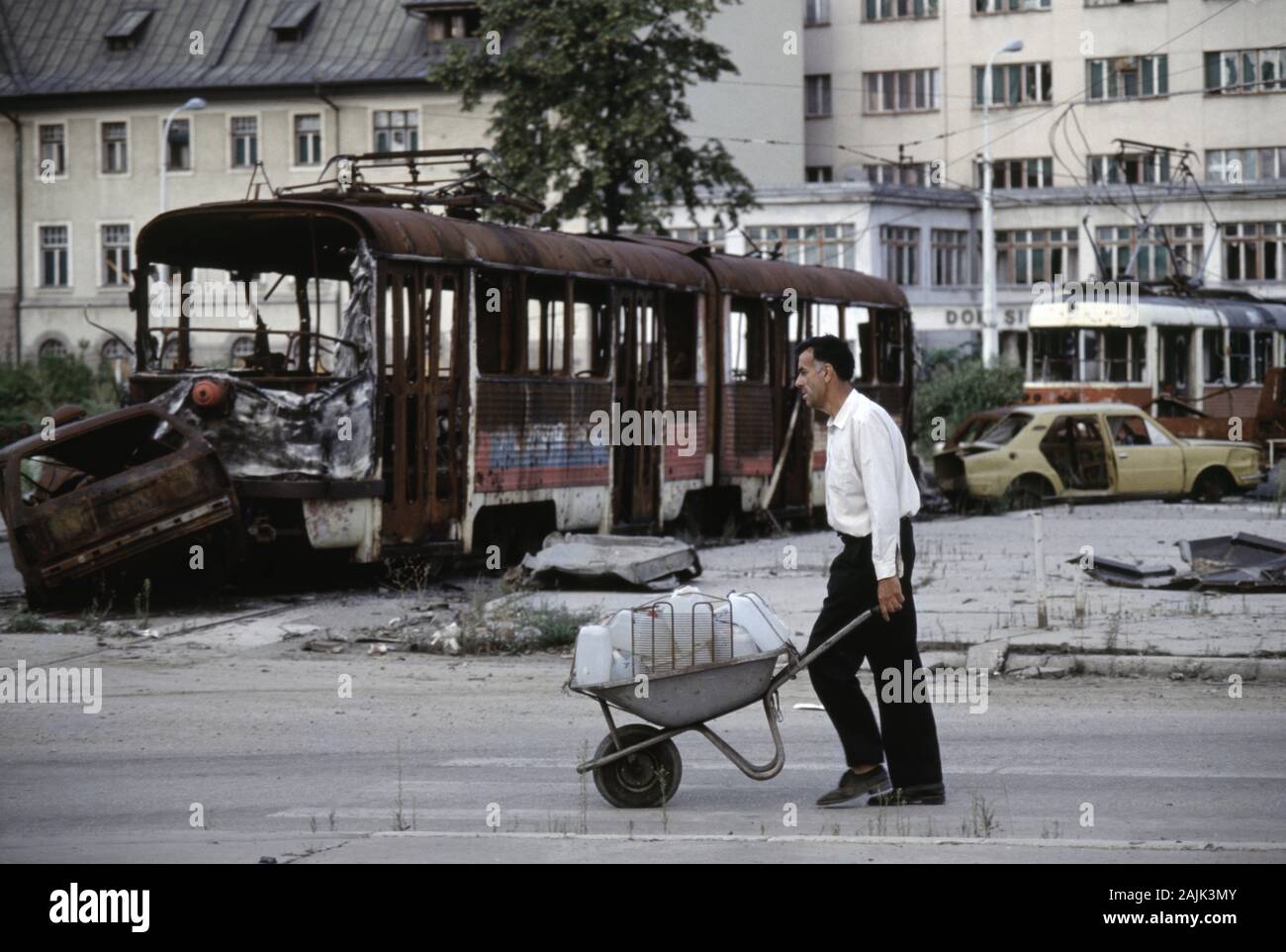 17th August 1993 During The Siege Of Sarajevo A Weary Man Pushes A 