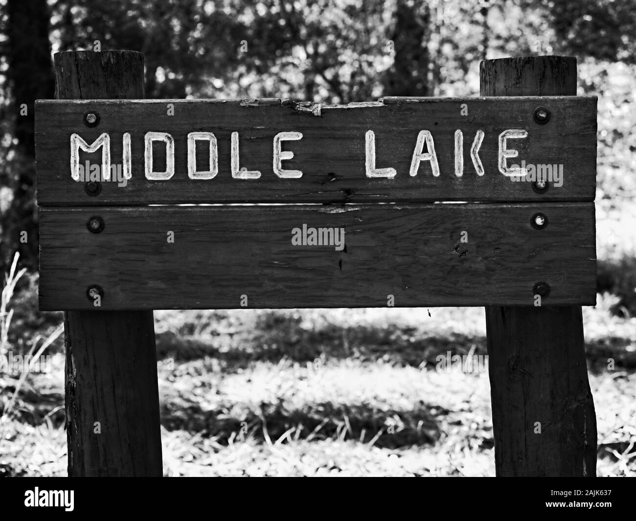 Conroe, TX USA - 11/15/2019  -  Middle Lake Wooden Sign B&W Stock Photo