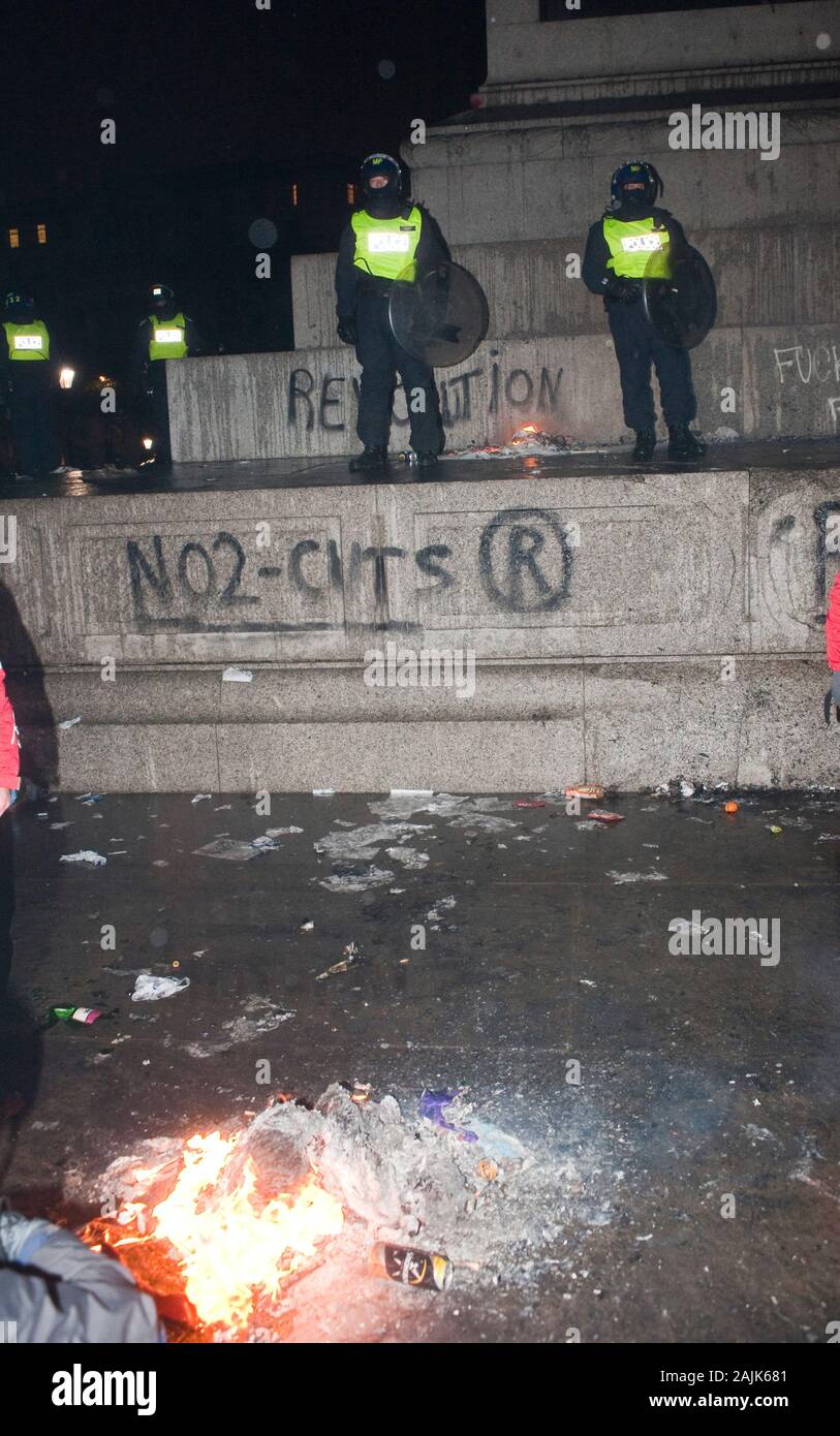 A demonstration by students and schoolchildren causing vandalism and graffiti around Trafalgar Square in London. The demonstration was held in opposition to planned spending cuts to further education and an increase of the cap on tuition fees by the Conservative-Liberal Democrat coalition government following their review into higher education funding in England. Stock Photo